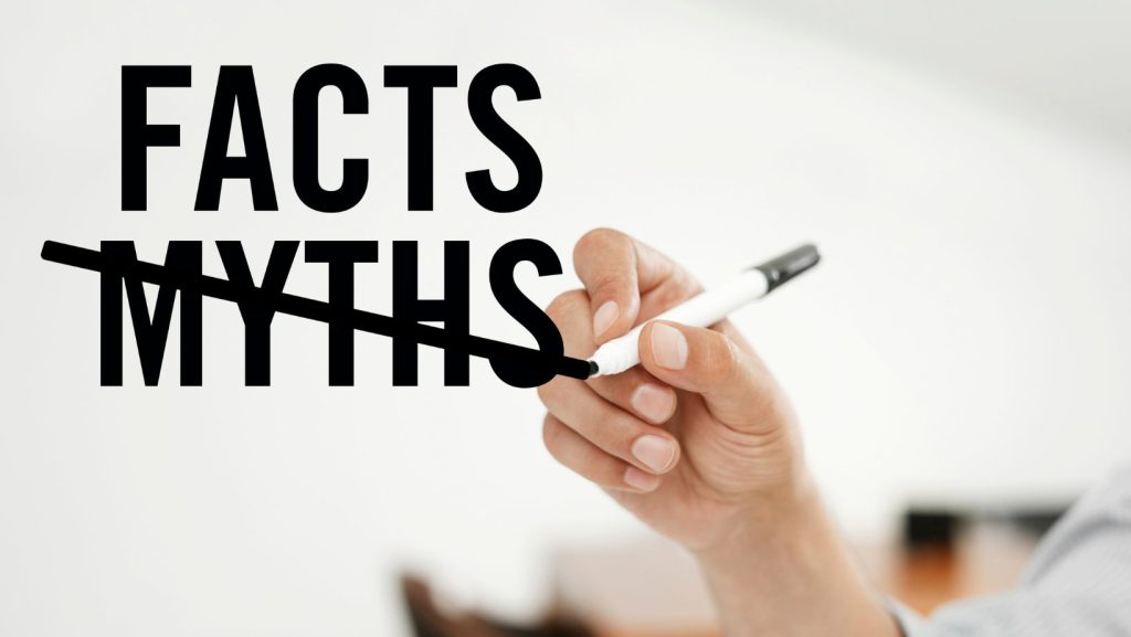 The words "Facts" and "Myths" written and someone crossing out the myths